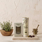 Pelops olive oil and thyme bundle styled with fresh olives and Greek pottery